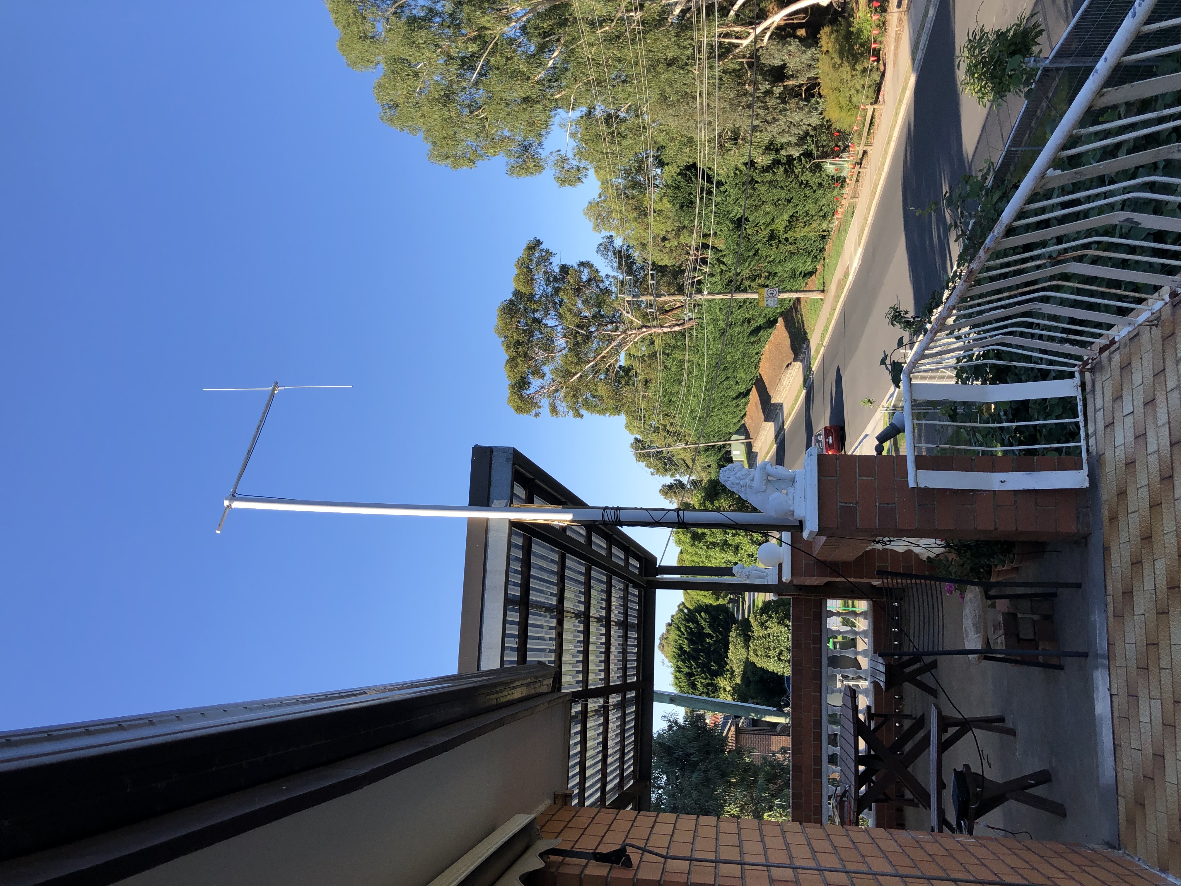 Dipole antenna mounted, attached to roof vertical support