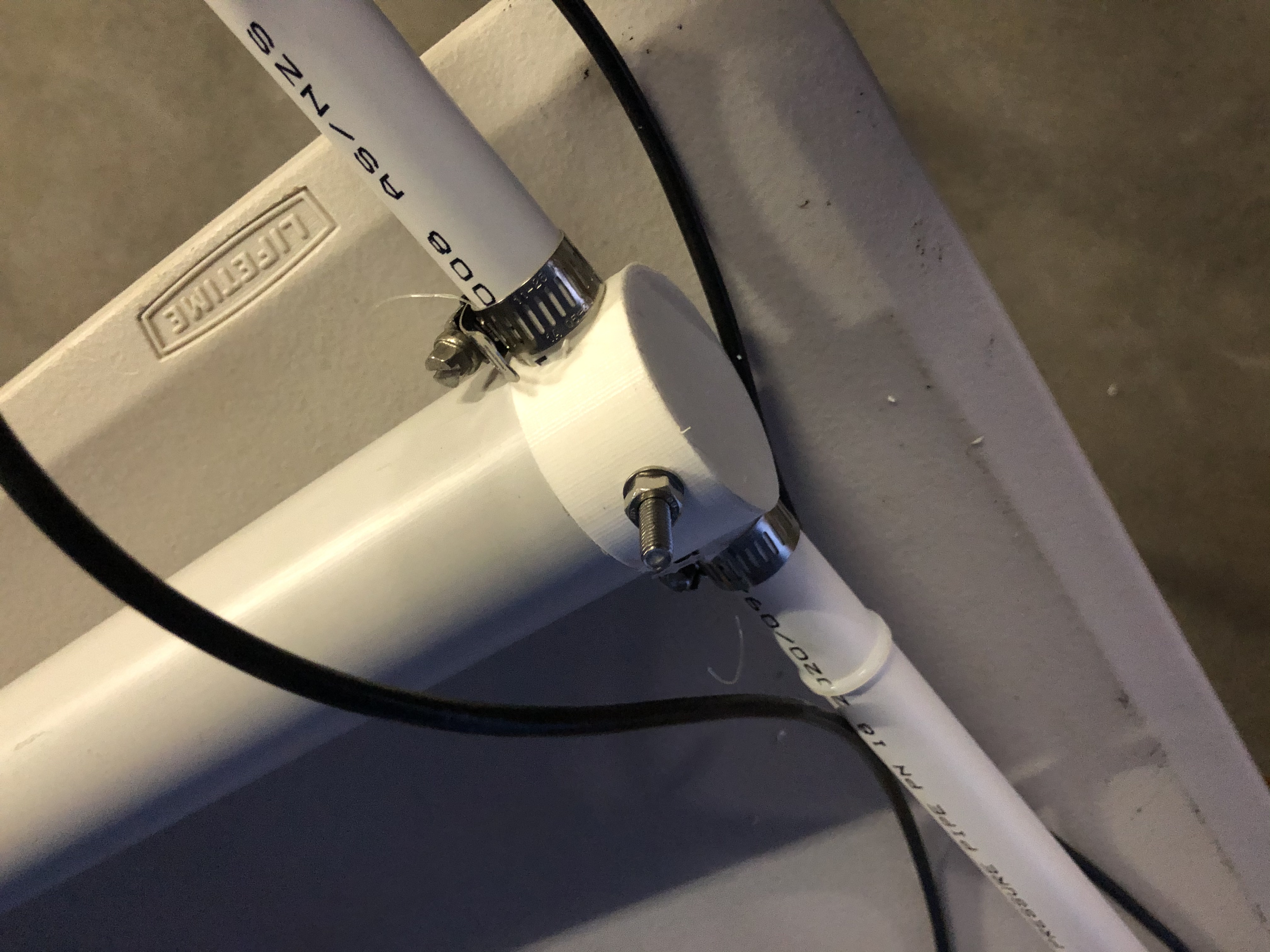 Close-up of antenna mount with bolt affixed to arrest rotation